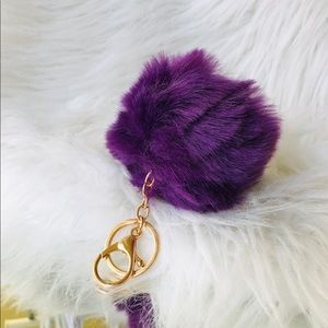 Purple faux fur keychain.